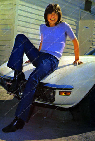 David Cassidy on the hood of his corvette 8b20-13880