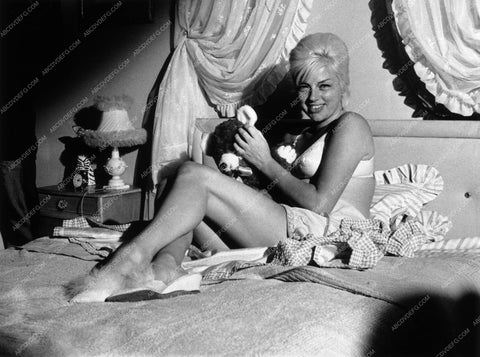 Diana Dors sitting on bed playing with her stuffed animals 8b20-13953