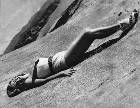 beautiful Corinne Calvet laying in the sand 8b20-13980