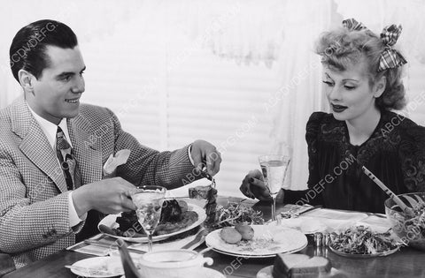 Lucille Ball Desi Arnaz sit down for a hearty meal 8b20-14130