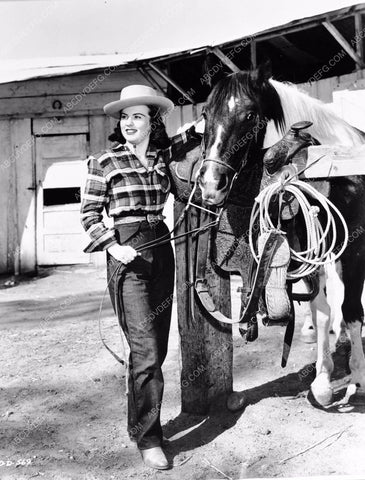 cowgirl Deanna Durbin tending to the horses 8b20-14329