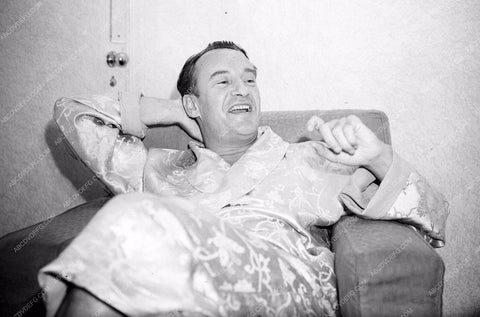 candid George Sanders takes it easy for a minute 8b20-14475