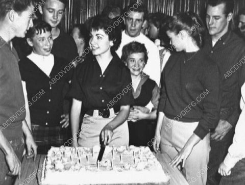 candid Annette Funicello cuts birthday cake surrounded by friends 8b20-14955
