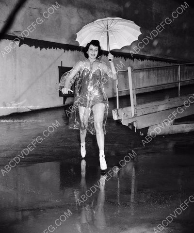 Gail Russell in transparant rain slicker and umbrella 8b20-15060