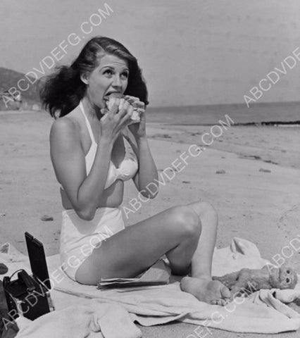 beautiful Rita Hayworth enjoys a sandwich on the beach 8b20-15207