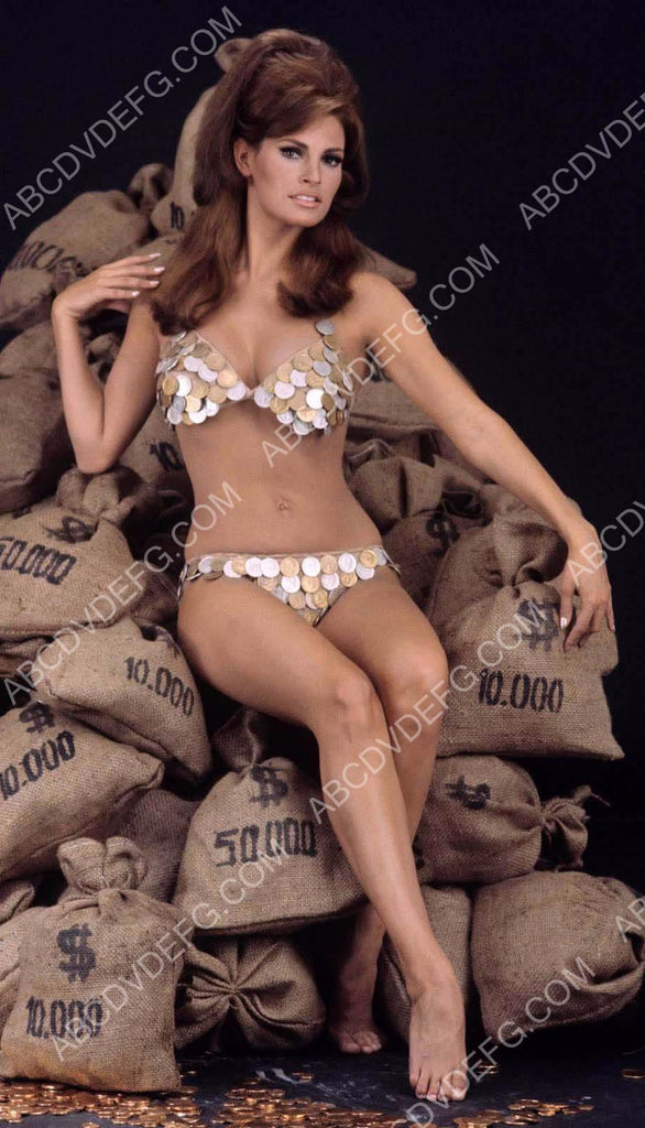 Raquel Welch in coin bikini sitting on bags of money 8b20 15490