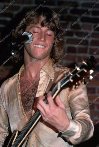 Andy Gibb jamming on his guitar 8b20-15594