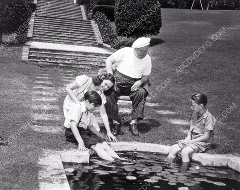 W.C. Fields and some kids check out the fish pond 8b20-16055