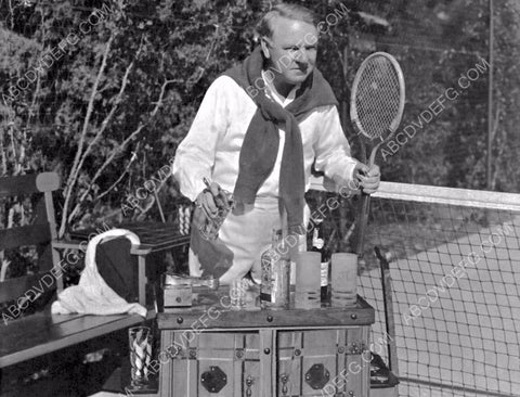 W.C. Fields w his traveling liquor cabinet on the tennis court 8b20-16067