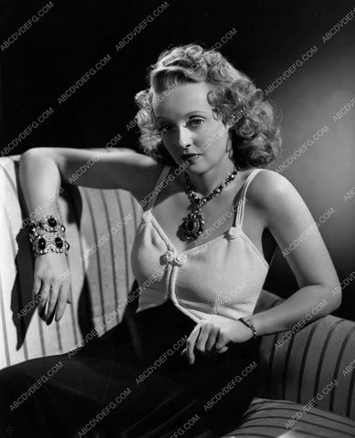 Bette Davis sitting on the chaise lounge 8b20-16246