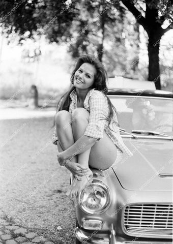 sexy in shorts Claudia Cardinale sitting on the fender of her car 8b20-17153