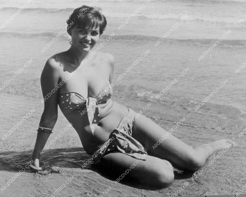 sexy Claudia Cardinale in her bikini sitting in the surf 8b20-17171