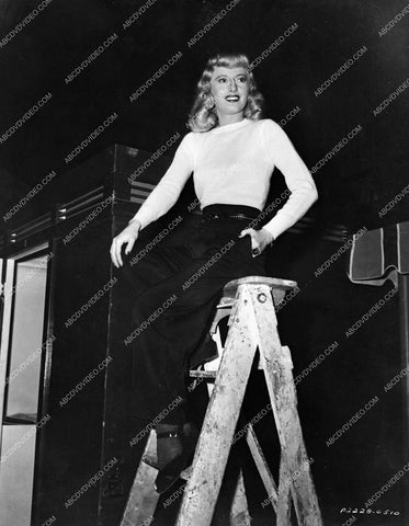 Barbara Stanwyck sitting on a ladder behind the scenes film noir Double Indemnity 8b20-17445