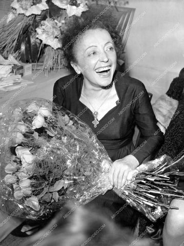 Edith Piaf in her dressing w flowers after the show 8b20-17748