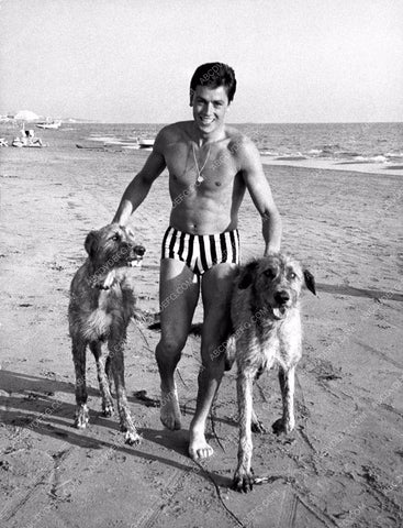 Alain Delon in speedos walks his dogs on the beach 8b20-1818