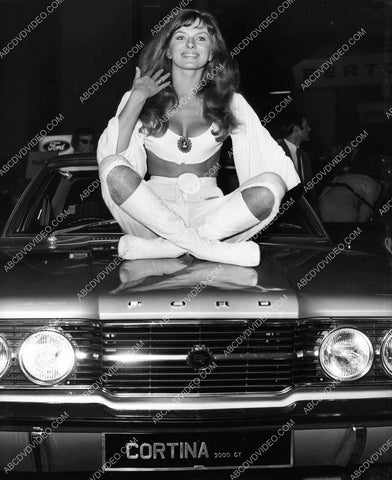 sexpot bombshell Julie Ege sitting on her new Ford Gran Torino muscle car 8b20-18770