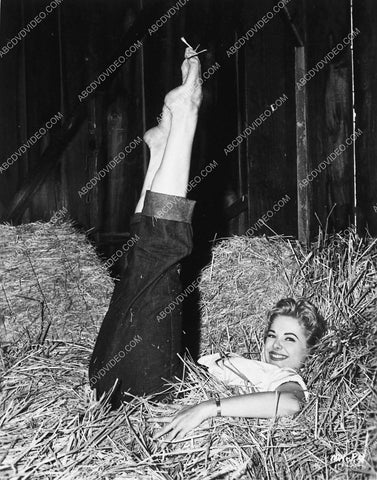 beautiful Martha Hyer laying n the hay pointing her feet skyward 8b20-18802