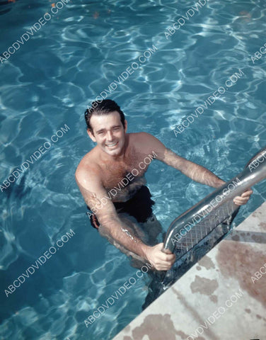 Stuart Whitman getting out of the swimming pool 8b20-19055