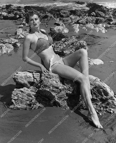 Irish McCalla and her long legs on the rocks at the beach 8b20-20133