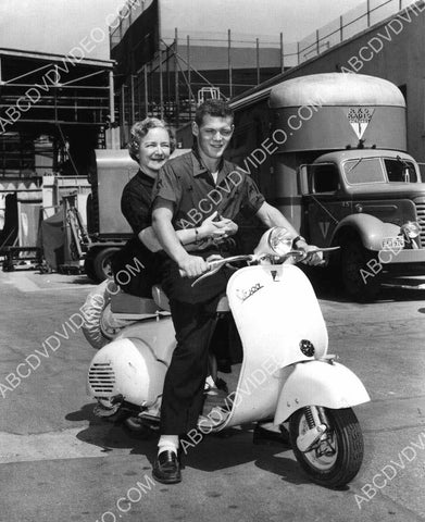 Helen Hayes James MacArthur ride a scooter around RKO Studios backlot 8b20-20344