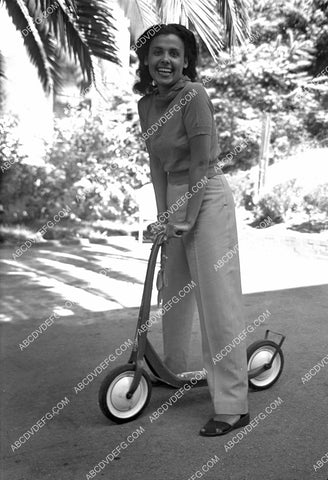 Lena Horne riding around on her scooter 8b20-20505