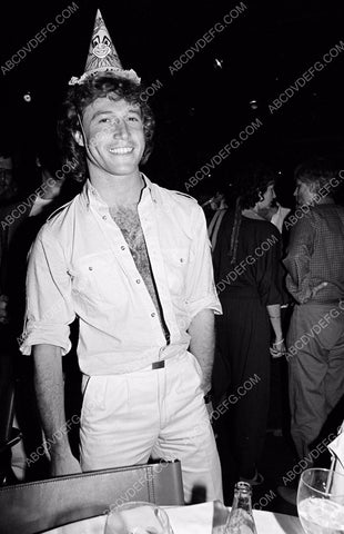 Andy Gibb having fun in silly birthday party hat 8b20-2055