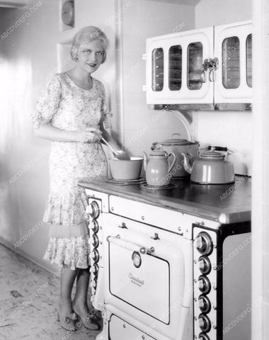 Ann Harding whipping something up at the stove 8b20-2329