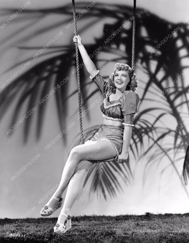 sexy Anne Gwynne in shorts sitting on the swing 8b20-2577