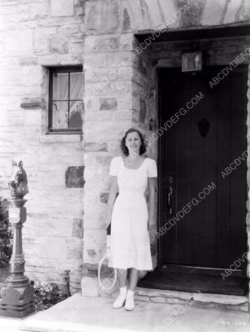 Barbara Stanwyck heading out for a game of tennis 8b20-3535