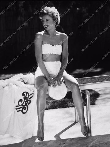 Barbara Stanwyck in swimwear sitting on the diving board 8b20-3580