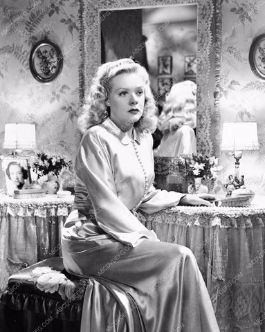 Alice Faye seated at the night table 8b20-3685