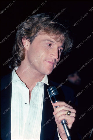 Andy Gibb with microphone pic 8b20-3831