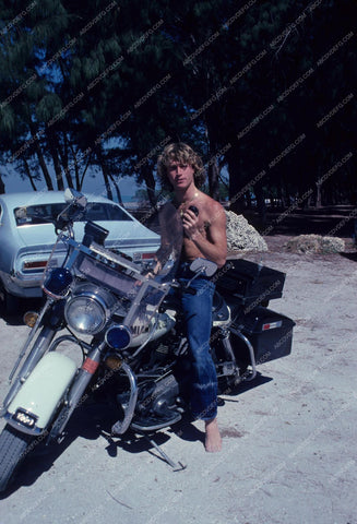 Andy Gibb has a little fun on a police motorcycle 8b20-3837