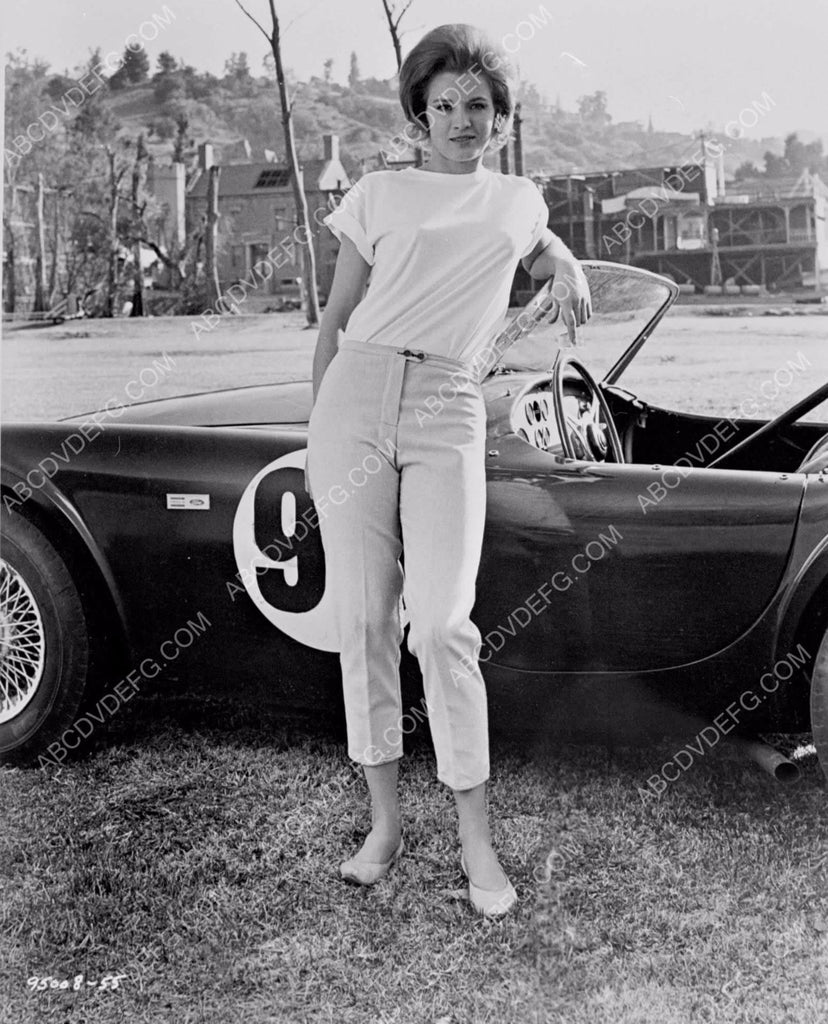 hot Angie Dickinson in front of cool racecar 8b20-3860