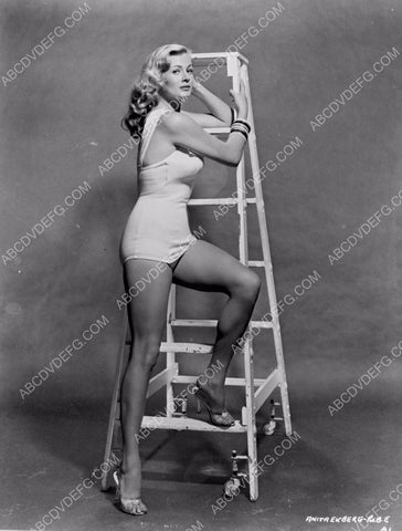 Anita Ekberg in swimsuit standing on a ladder 8b20-3990