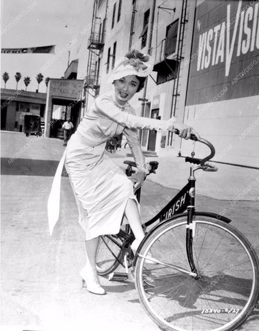 Ann Blyth gets around Paramount backlot on bicycle 8b20-4044