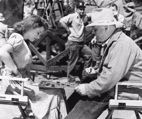 candid Anne Baxter plays checkers behind the scenes to pass time 8b20-4185