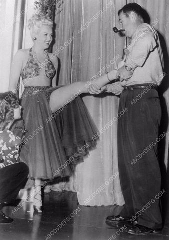 Betty Grable has a cramp in her calf maybe 8b20-4822