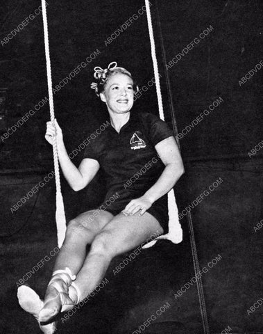 athletic Betty Hutton practices on circus trapeze swing 8b20-4906