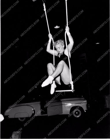 athletic Betty Hutton practices on circus trapeze swing 8b20-4909