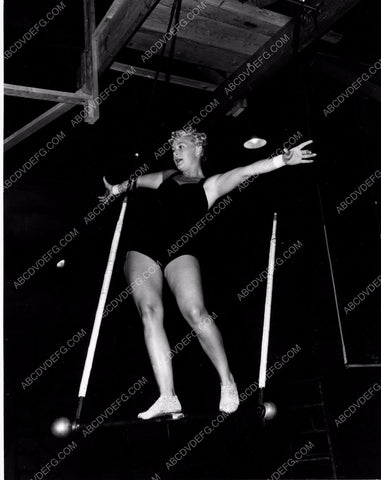 athletic Betty Hutton practices on circus trapeze swing 8b20-4910
