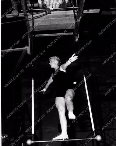 athletic Betty Hutton practices on circus trapeze swing 8b20-4911