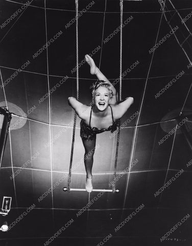 athletic Betty Hutton practices on circus trapeze swing 8b20-4914