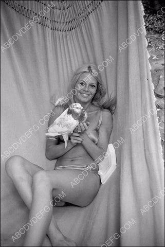 Brigitte Bardot in hammock with a bird 8b20-5281