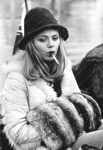 Britt Ekland smoking a cigarette out in the cold 8b20-5429