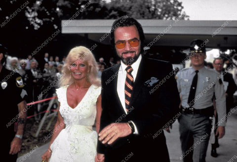 Burt Reynolds Lonnie Anderson arrive at some event 8b20-5598