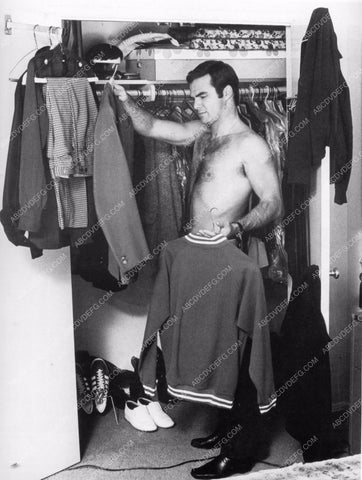 shirtless Burt Reynolds selects his wardrobe 8b20-5599