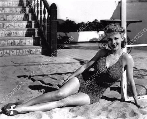 sexy Carole Landis in swimwear sitting in the sand 8b20-5931