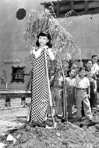 Anna May Wong and some kids plant a tree 8b20-6587
