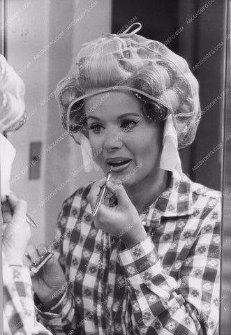 Connie Stevens in curlers putting lipstick on 8b20-7143